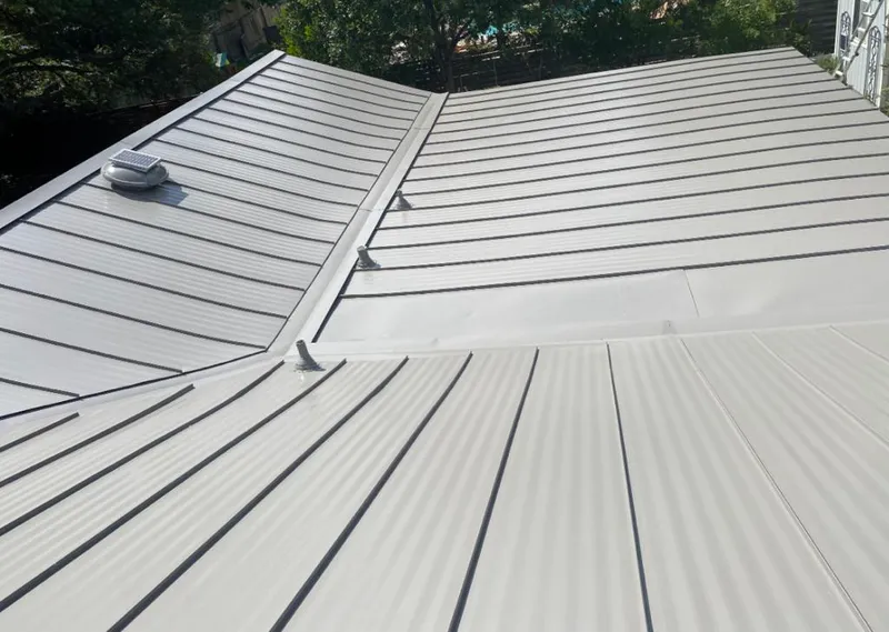 Solar attic fan installed on a metal roof for Roof Ventilation in Port Orchard